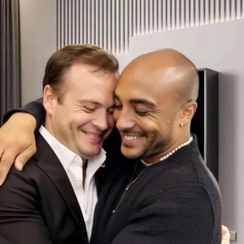 Two Men Hugging, Smiling