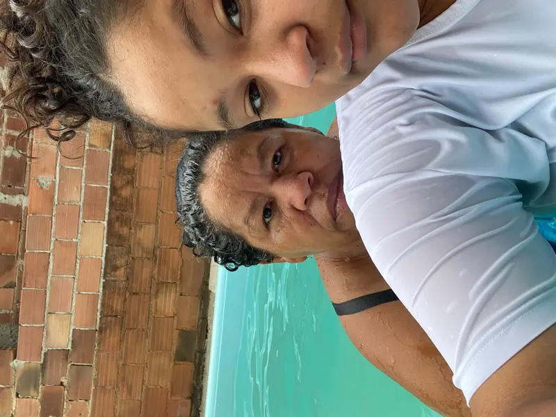 Two People In Swimming Pool