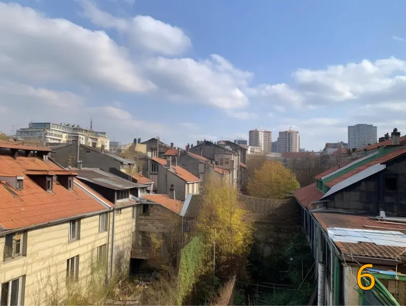 Urban Rooftops Under Cloudy Sky