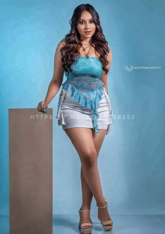 Woman In Blue And White Attire