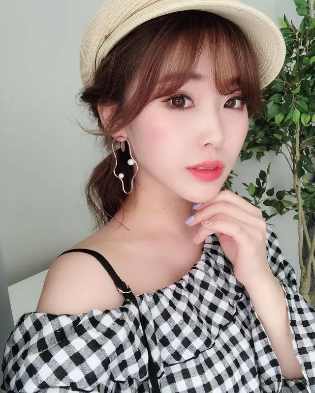 Woman In Checkered Top Posing