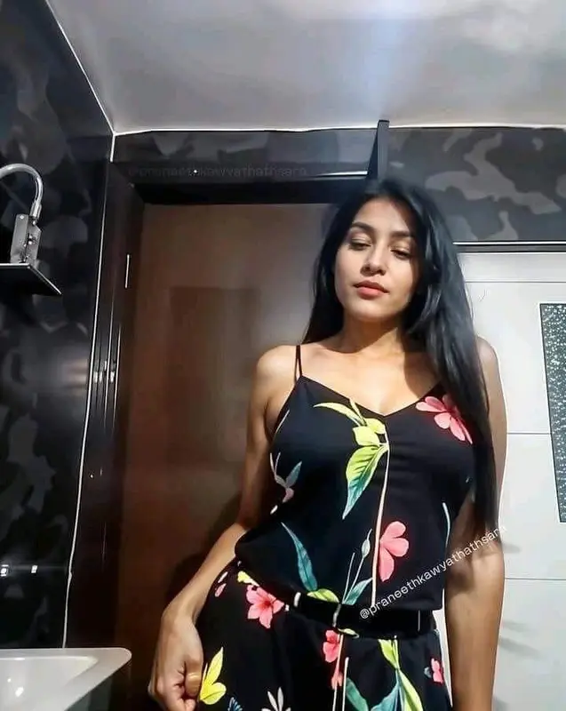 Woman In Floral Dress Posing