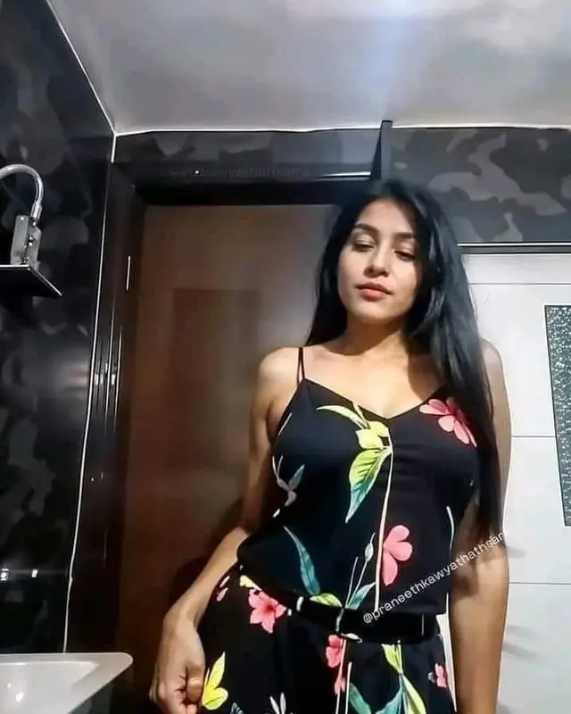 Woman In Floral Dress Posing