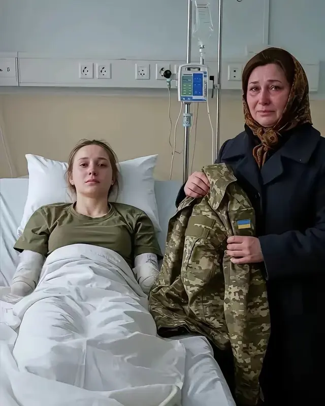 Woman In Hospital With Visitor