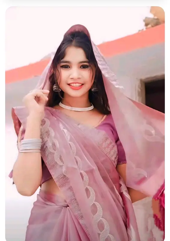 Woman In Pink Saree Smiling