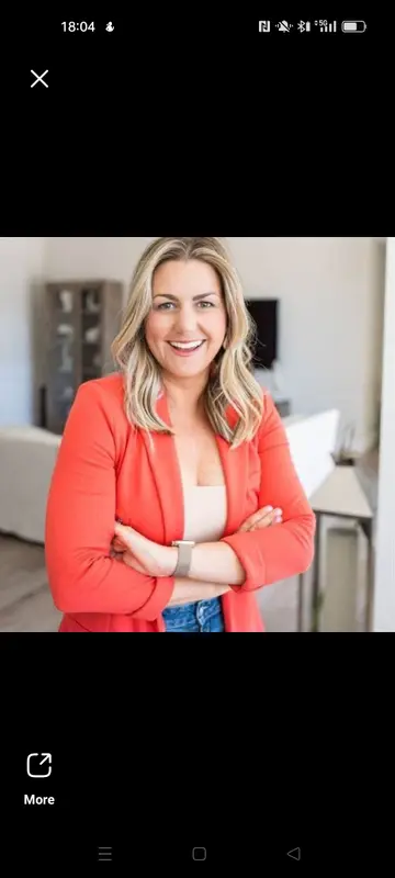 Woman In Red Blazer Smiling