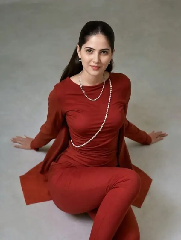 Woman In Red Outfit Sitting