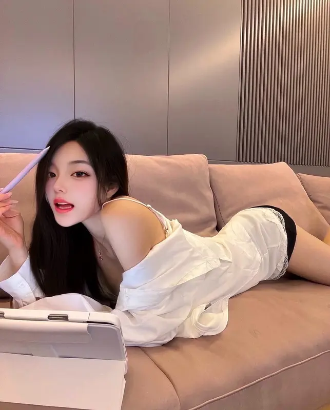 Woman Lounging With Tablet