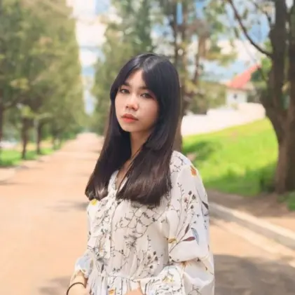 Woman On Tree-lined Pathway