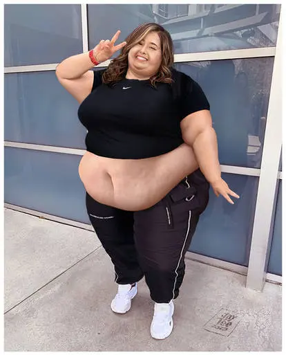 Woman Posing Outdoors Peace Sign