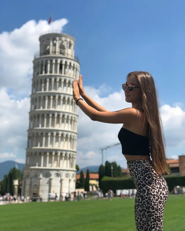 Woman Posing With Leaning Tower