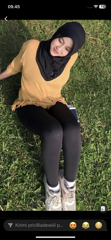 Woman Sitting On Grass