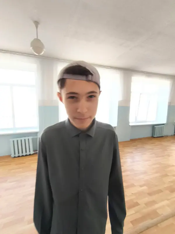 Young Person In Cap Indoors