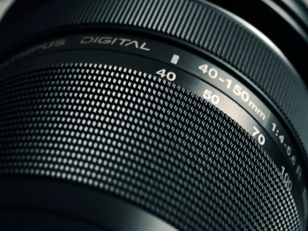 Close-up of a camera lens, representing close inspection of a photo to tell if it is AI-generated